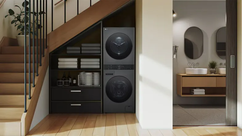 Under-stair closet highlighting a stacked washer and dryer unit Under-stair closet highlighting a stacked washer and dryer unit