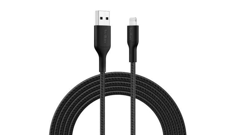 A Belkin USB-A to Lightning black braided cable coiled neatly in a semi-circle A Belkin USB-A to Lightning black braided cable coiled neatly in a semi-circle