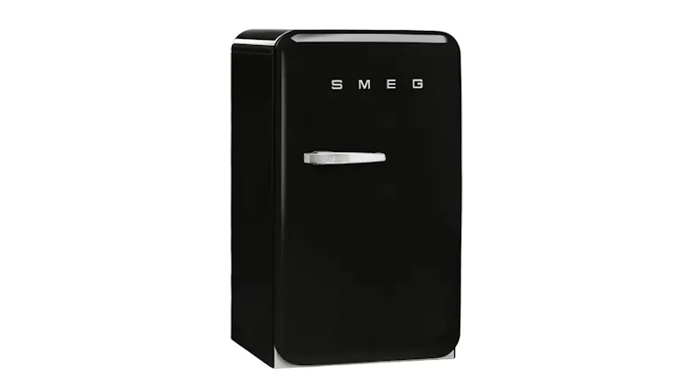 Angled view of a black Smeg 135L bar fridge with curved edges and a chrome handle Angled view of a black Smeg 135L bar fridge with curved edges and a chrome handle