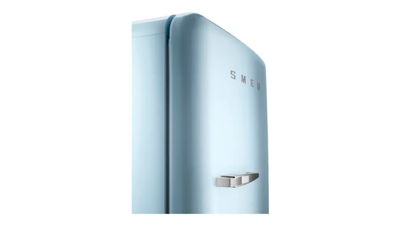 Close-up view of the upper corner of a Smeg Fridge Freezer, highlighting the metallic silver logo and handle Close-up view of the upper corner of a Smeg Fridge Freezer, highlighting the metallic silver logo and handle