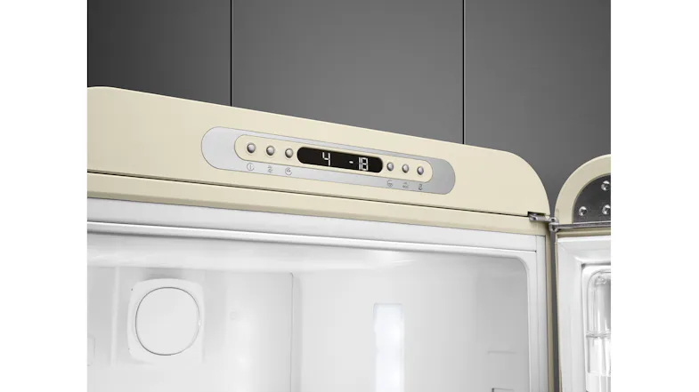 Close-up of the silver digital control panel on a retro cream refrigerator displaying temperature settings four and minus 18 Close-up of the silver digital control panel on a retro cream refrigerator displaying temperature settings four and minus 18
