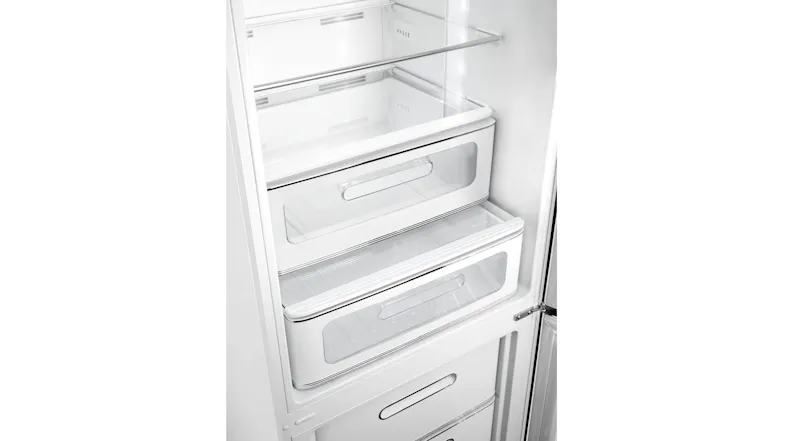 Interior view of the empty 50s Style retro refrigerator compartment, showing glass shelves and LED lighting Interior view of the empty 50s Style retro refrigerator compartment, showing glass shelves and LED lighting