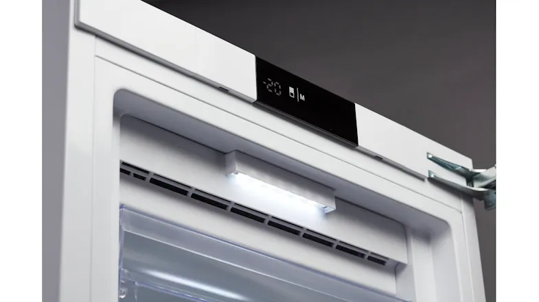 Close-up of the freezer’s top interior with an LED light, air vents, and a digital control display panel Close-up of the freezer’s top interior with an LED light, air vents, and a digital control display panel