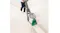 High-angle view of a person vacuuming a wide hallway carpet High-angle view of a person vacuuming a wide hallway carpet