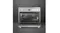 Open stainless steel Smeg oven showing interior racks, a tray, and fan vents, with control knobs above Open stainless steel Smeg oven showing interior racks, a tray, and fan vents, with control knobs above