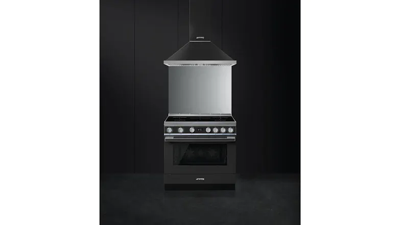 Smeg freestanding induction cooker beneath a sleek stainless steel rangehood in a contemporary kitchen setup Smeg freestanding induction cooker beneath a sleek stainless steel rangehood in a contemporary kitchen setup