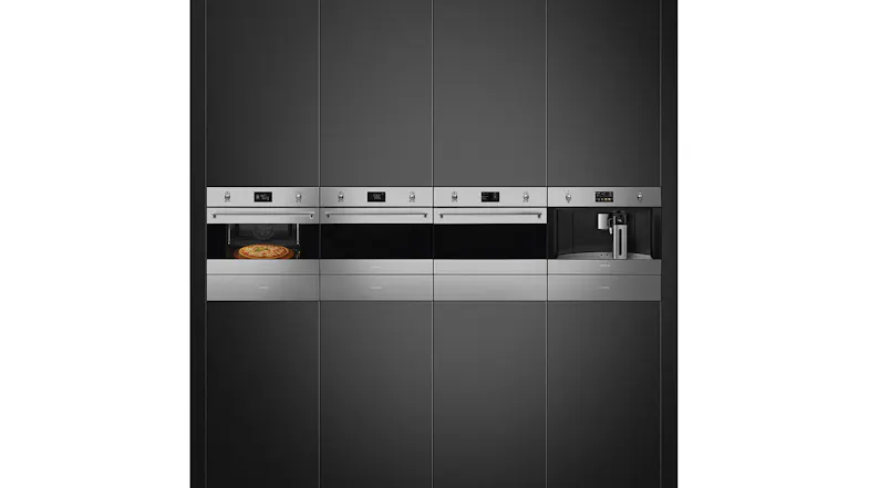 Built-in kitchen appliances, including ovens and a coffee machine; one oven displays a pizza inside Built-in kitchen appliances, including ovens and a coffee machine; one oven displays a pizza inside