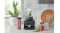 Marble counter highlighting the blender beside a filled portable cup Marble counter highlighting the blender beside a filled portable cup