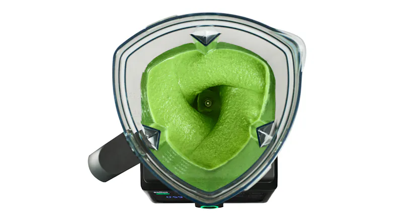 Top-down view of the triangular jug showing a thick green smoothie inside Top-down view of the triangular jug showing a thick green smoothie inside