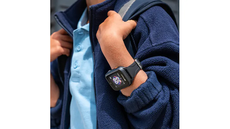 Close-up view of a boy wearing a backpack with a smartwatch on his wrist Close-up view of a boy wearing a backpack with a smartwatch on his wrist