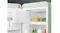 Retro SMEG refrigerator showing freezer area and fresh food stored on glass shelves Retro SMEG refrigerator showing freezer area and fresh food stored on glass shelves