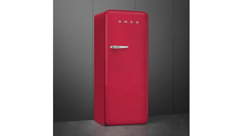Three-quarter view of a red SMEG retro refrigerator with a chrome handle Three-quarter view of a red SMEG retro refrigerator with a chrome handle