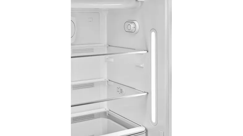 Interior view of a refrigerator with glass shelves, a control dial, and a vertical LED light panel on the side wall Interior view of a refrigerator with glass shelves, a control dial, and a vertical LED light panel on the side wall