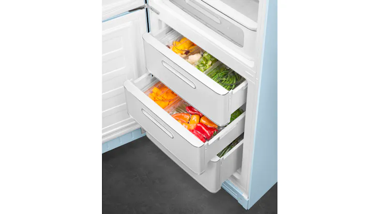 SMEG refrigerator freezer drawers showing fresh vegetables and food neatly stored SMEG refrigerator freezer drawers showing fresh vegetables and food neatly stored