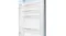 A close-up view of the open refrigerator door showcasing four clear storage shelves A close-up view of the open refrigerator door showcasing four clear storage shelves