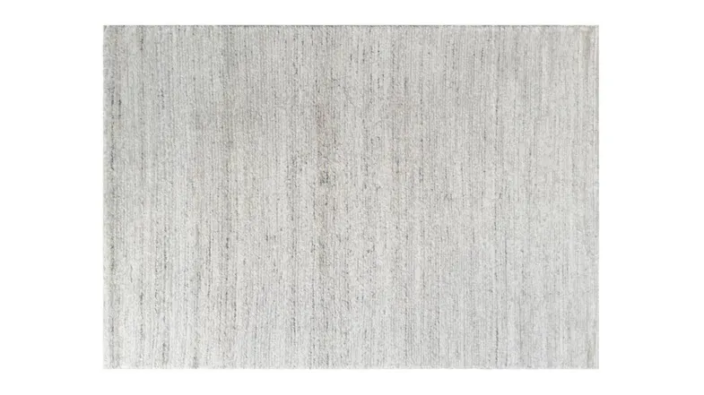 Full view of beige rug surface showing soft, even texture with subtle woven detail Full view of beige rug surface showing soft, even texture with subtle woven detail