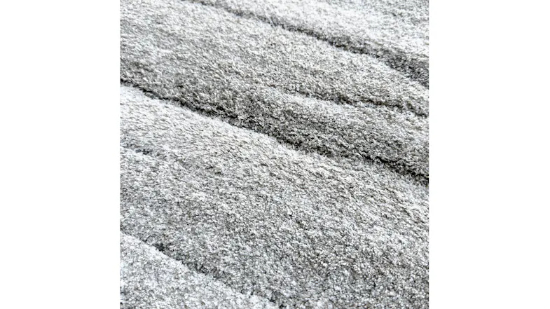 Close-up view of the Strata Drift area rug showing plush shaggy texture Close-up view of the Strata Drift area rug showing plush shaggy texture