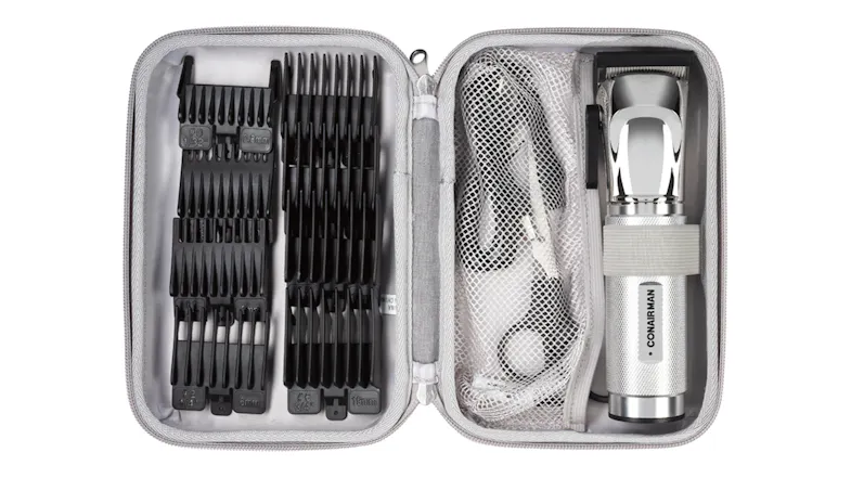 Open ConairMAN grooming case with cordless hair clipper, guide combs, charging cable, and accessories Open ConairMAN grooming case with cordless hair clipper, guide combs, charging cable, and accessories