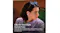 Profile view of a person wearing purple earbuds outdoors Profile view of a person wearing purple earbuds outdoors