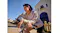 Front view of a person sitting on a bicycle while wearing an earbud Front view of a person sitting on a bicycle while wearing an earbud