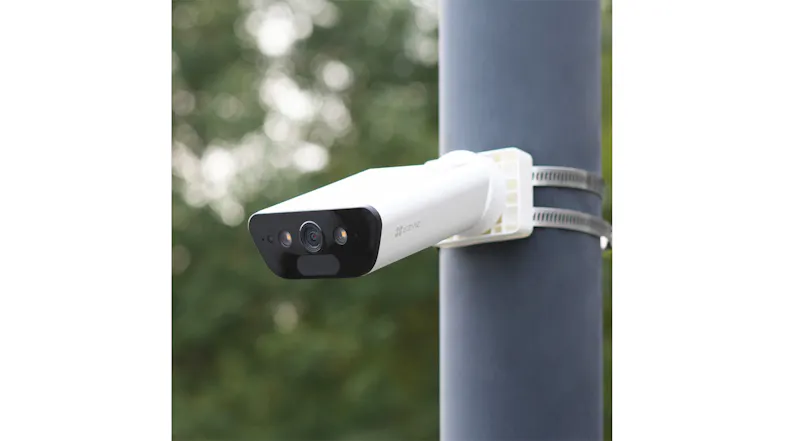Security camera attached to a pole outdoors, showcasing flexible mounting options Security camera attached to a pole outdoors, showcasing flexible mounting options