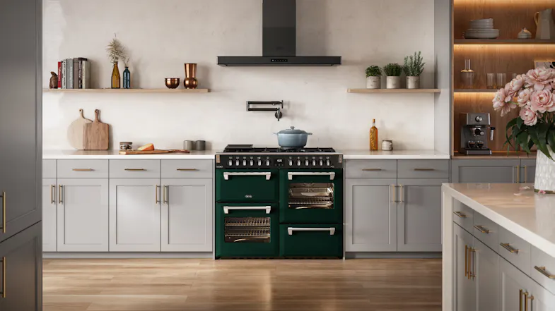 Belling freestanding cooker neatly framed by light grey kitchen cabinets and a pot filler Belling freestanding cooker neatly framed by light grey kitchen cabinets and a pot filler