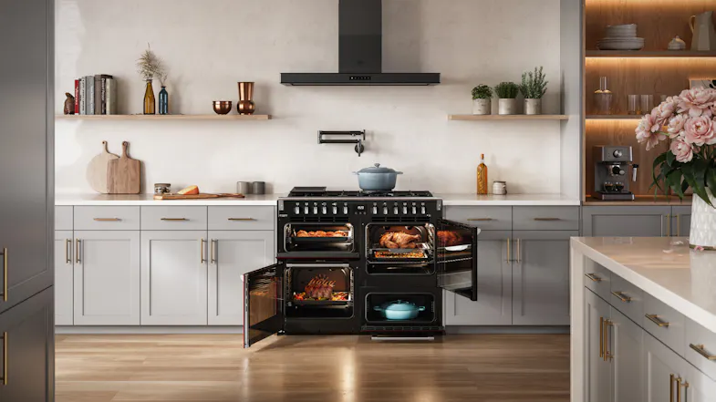 Open doors of the interior Belling Freestanding Oven filled with roasts, set in a light grey kitchen Open doors of the interior Belling Freestanding Oven filled with roasts, set in a light grey kitchen