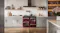 Belling freestanding cooker neatly framed by light grey kitchen cabinets and a p Belling freestanding cooker neatly framed by light grey kitchen cabinets and a p