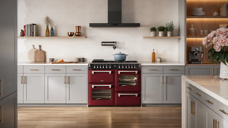 Belling freestanding cooker neatly framed by light grey kitchen cabinets and a p Belling freestanding cooker neatly framed by light grey kitchen cabinets and a p