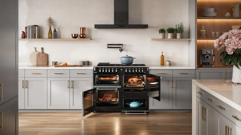 Open doors of the interior Belling Freestanding Oven filled with roasts, set in a light grey kitchen Open doors of the interior Belling Freestanding Oven filled with roasts, set in a light grey kitchen