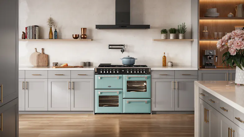 Belling freestanding cooker neatly framed by light grey kitchen cabinets and a pot filler Belling freestanding cooker neatly framed by light grey kitchen cabinets and a pot filler