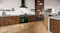 A modern kitchen with a Belling range oven and wood cabinetry A modern kitchen with a Belling range oven and wood cabinetry