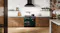 A luxury kitchen with a freestanding oven filled with cooked dishes A luxury kitchen with a freestanding oven filled with cooked dishes