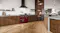 A modern kitchen with a Belling range oven and wood cabinetry A modern kitchen with a Belling range oven and wood cabinetry