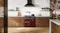 A luxury kitchen with a freestanding oven filled with cooked dishes A luxury kitchen with a freestanding oven filled with cooked dishes