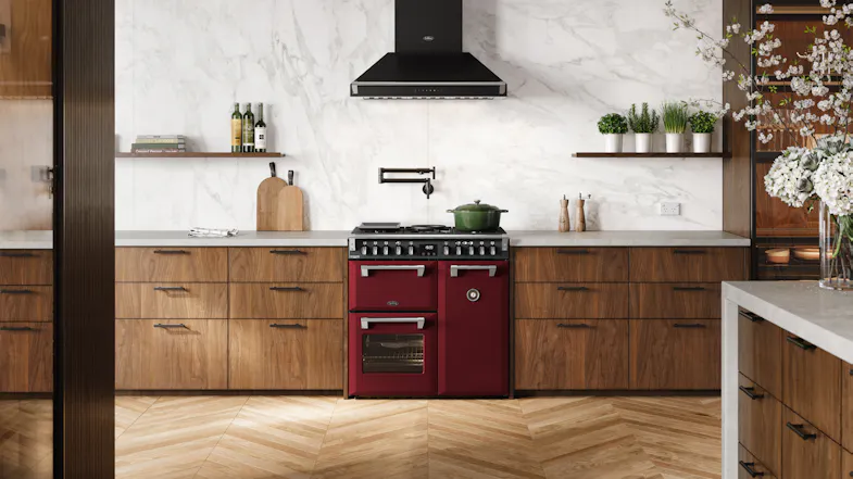 A luxury kitchen with a freestanding oven filled with cooked dishes A luxury kitchen with a freestanding oven filled with cooked dishes