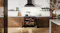 Belling Garnet Red range cooker displayed in a kitchen with both oven compartments illuminated Belling Garnet Red range cooker displayed in a kitchen with both oven compartments illuminated