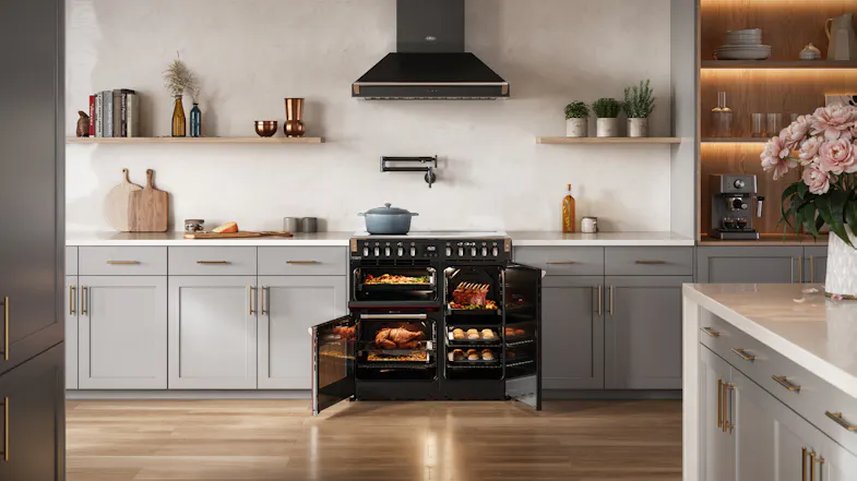 The range cooker with oven interiors lit and doors open, highlighting the multi-oven configuration The range cooker with oven interiors lit and doors open, highlighting the multi-oven configuration