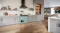 Open-plan kitchen featuring the Belling 90cm Seafoam Blue freestanding cooker as a focal point Open-plan kitchen featuring the Belling 90cm Seafoam Blue freestanding cooker as a focal point