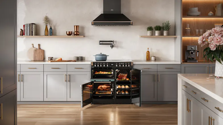 The range cooker with oven interiors lit and doors open, highlighting the multi-oven configuration The range cooker with oven interiors lit and doors open, highlighting the multi-oven configuration