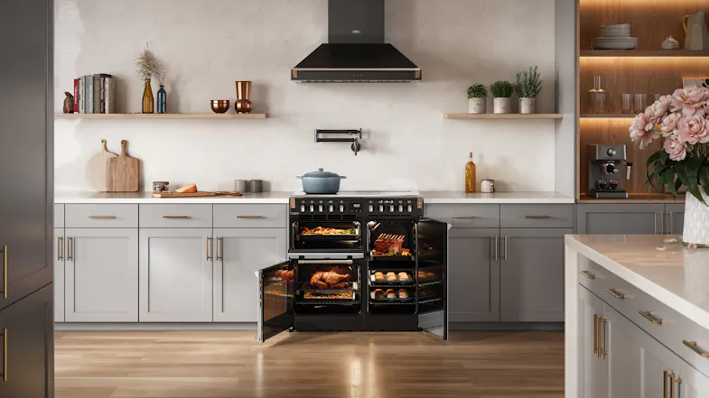 The range cooker with oven interiors lit and doors open, highlighting the multi-oven configuration The range cooker with oven interiors lit and doors open, highlighting the multi-oven configuration