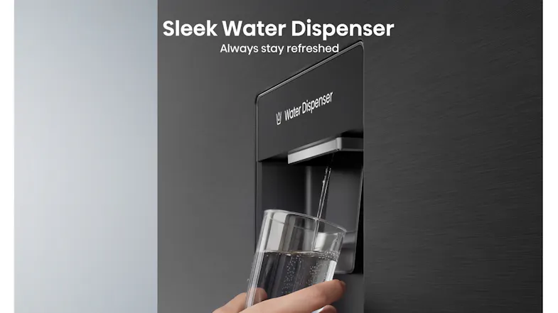 Close-up of the built-in water dispenser on the refrigerator door, showing a glass being filled with chilled water Close-up of the built-in water dispenser on the refrigerator door, showing a glass being filled with chilled water