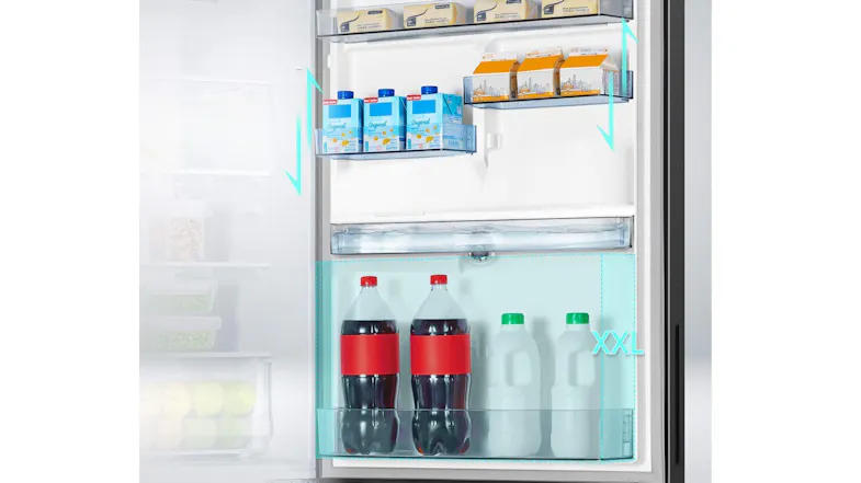 Close-up of the refrigerator interior stocked with beverages and food items, showcasing spacious shelving Close-up of the refrigerator interior stocked with beverages and food items, showcasing spacious shelving