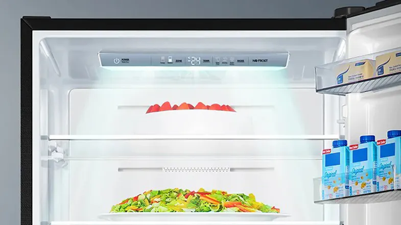 Interior view of the refrigerator compartment, highlighting bright LED lighting and spacious shelving Interior view of the refrigerator compartment, highlighting bright LED lighting and spacious shelving