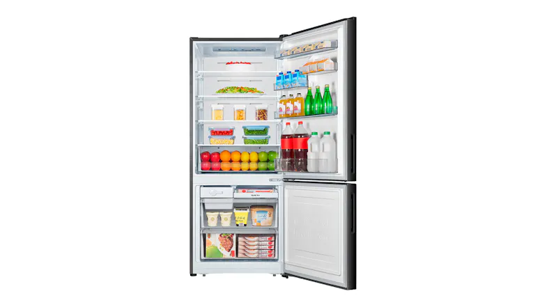 Interior view of the Hisense fridge stocked with groceries and beverages, highlighting organised shelf storage Interior view of the Hisense fridge stocked with groceries and beverages, highlighting organised shelf storage