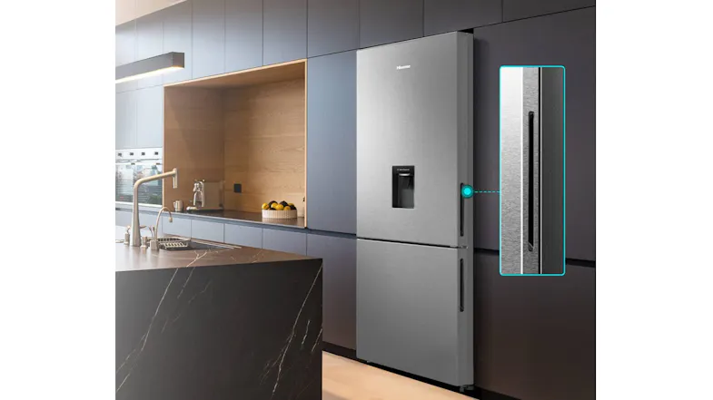 Lifestyle image of the Hisense 415L fridge freezer installed in a modern kitchen, showcasing its counter-depth profile Lifestyle image of the Hisense 415L fridge freezer installed in a modern kitchen, showcasing its counter-depth profile