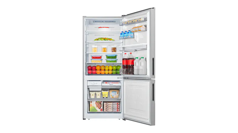 Interior view of the Hisense refrigerator stocked with groceries and beverages, showcasing spacious shelving Interior view of the Hisense refrigerator stocked with groceries and beverages, showcasing spacious shelving