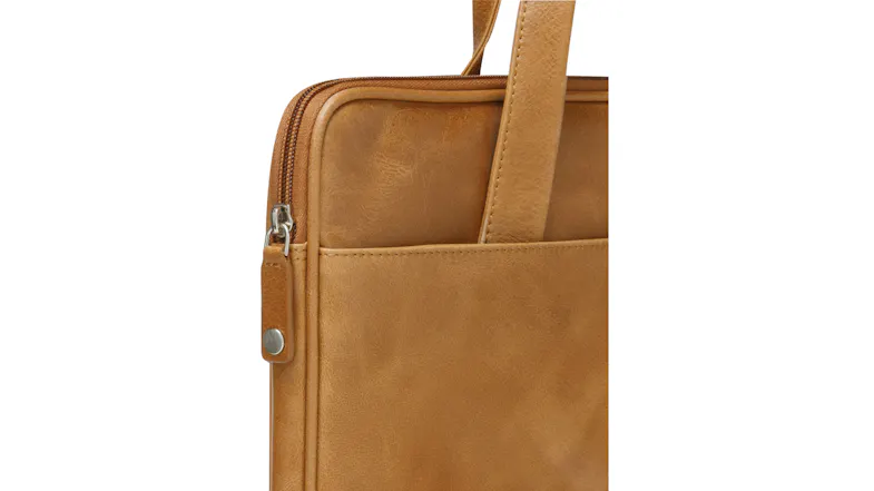 Close-up view of the bag with leather surface and smooth edges Close-up view of the bag with leather surface and smooth edges