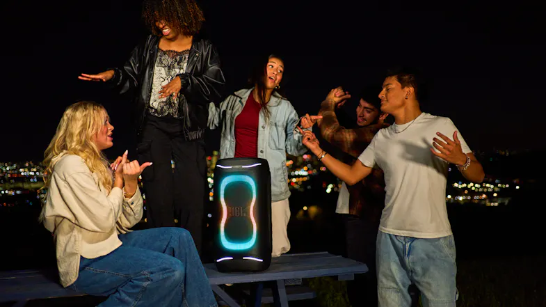 A view of a bunch of people dancing around the speaker A view of a bunch of people dancing around the speaker