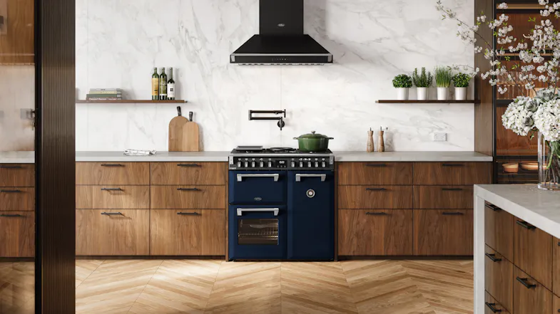 A luxury kitchen with a freestanding oven filled with cooked dishes A luxury kitchen with a freestanding oven filled with cooked dishes